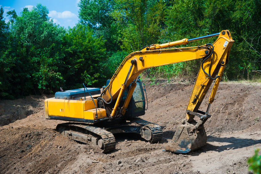 An excavator working removing earth on a construction site